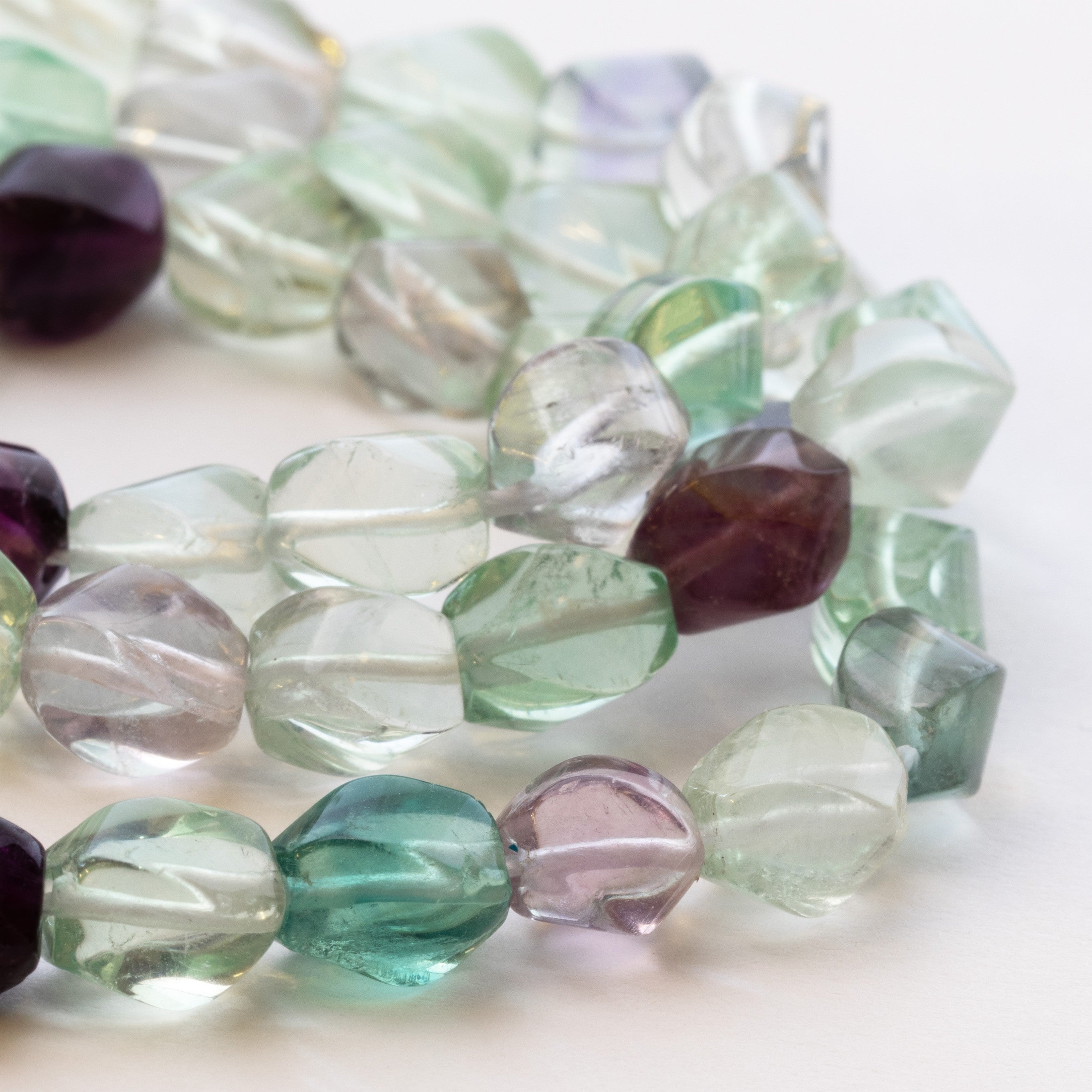 Rainbow Fluorite Twisted Beads Approx 8x6mm