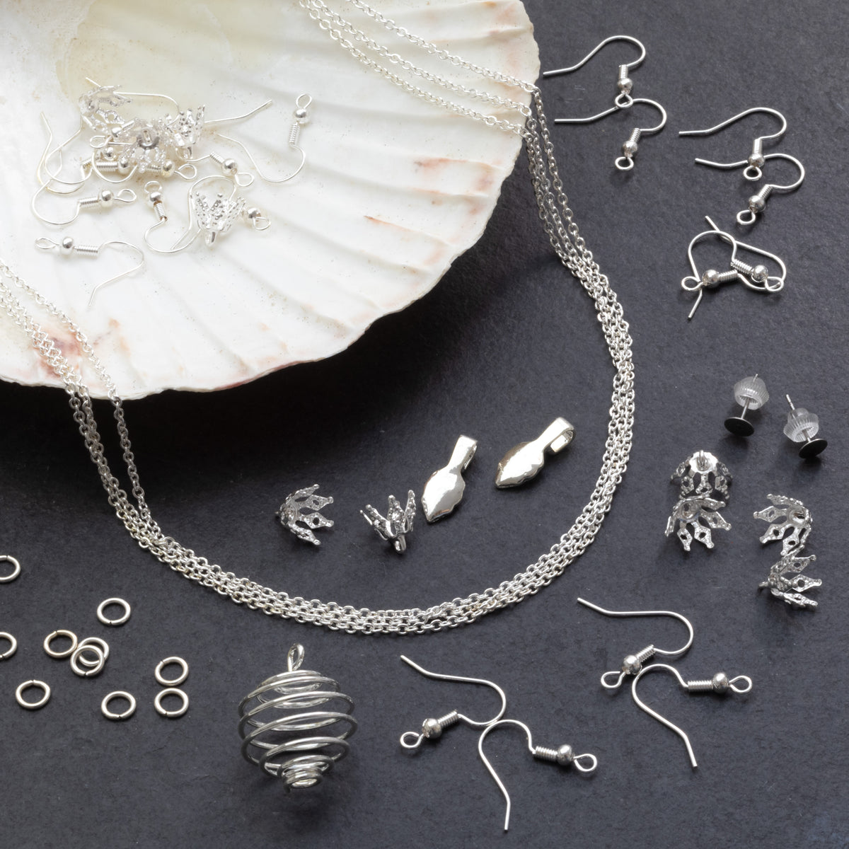 Jewellery components included in the sea glass jewellery making kit, including chains, earring findings and settings